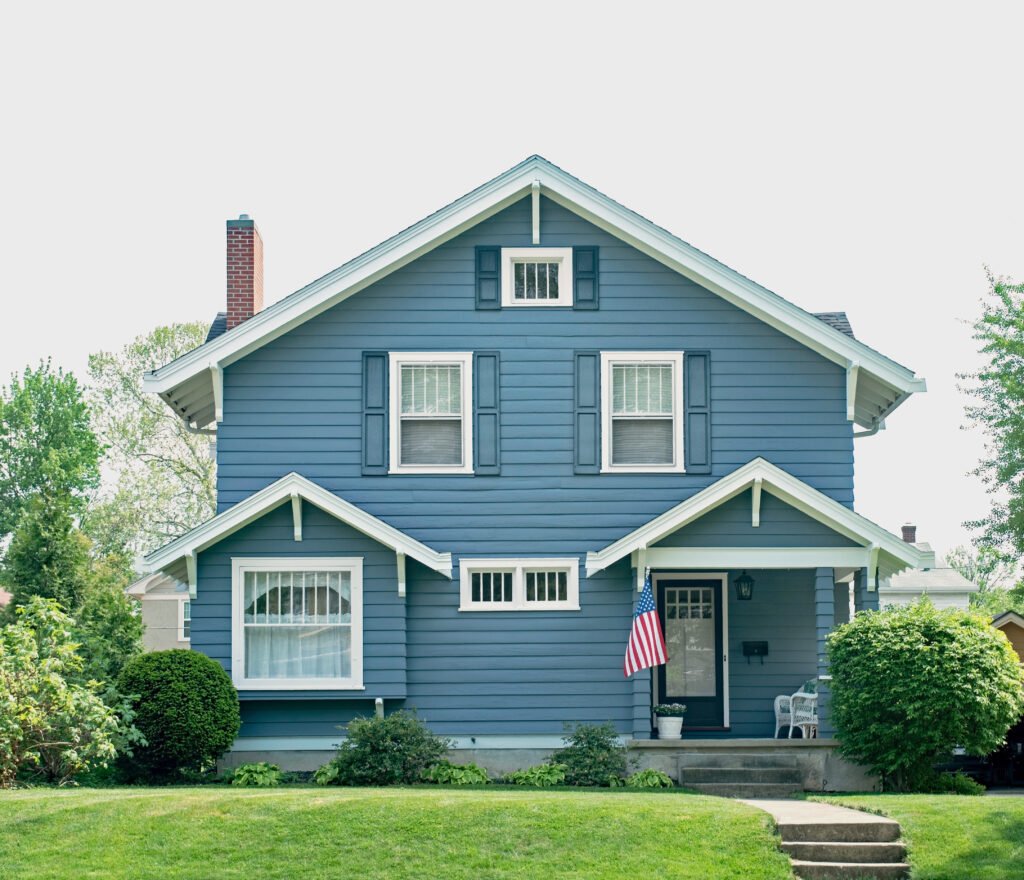 Home basic blue house with small porch